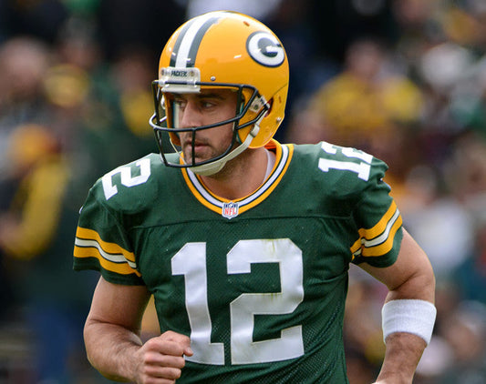 Aaron Rodgers in an archival 2014 photograph by Mike Morbeck via Wikimedia Commons, CC BY-SA 2.0; Brittani remains private and is not pictured