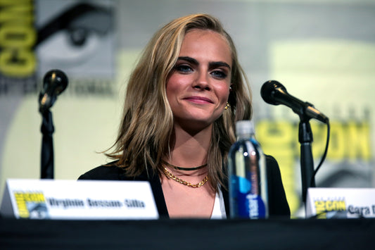 Cara Delevingne speaking at San Diego Comic-Con in July 2016; archival photo by Gage Skidmore, CC BY-SA 2.0, not from the 2026 Not Normal album campaign.