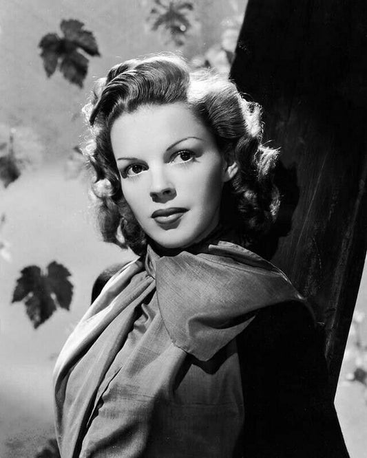 Judy Garland in a circa-1940s studio publicity portrait; archival public-domain image via Wikimedia Commons