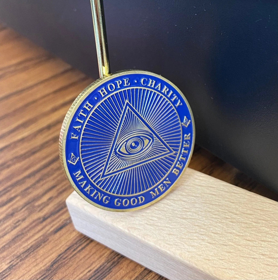 Square and compasses Masonic coin illustrating a guide to DeMolay and its relationship to Freemasonry