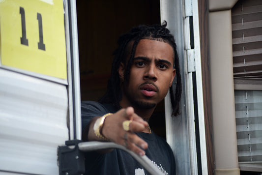 Vic Mensa backstage in 2017; archival image by Fr8nkmorales, CC BY-SA 4.0 via Wikimedia Commons.