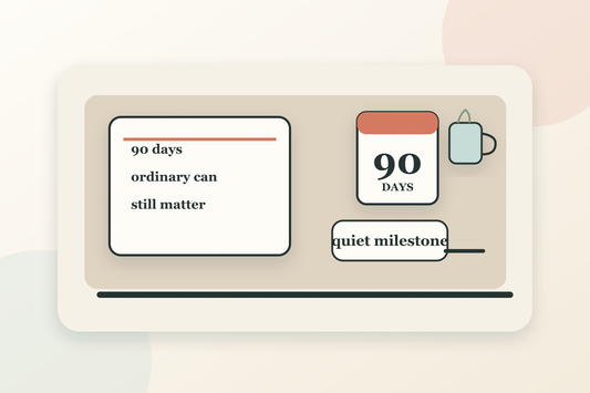 A quiet 90-day sobriety milestone scene with a journal, calendar and tea on a morning table
