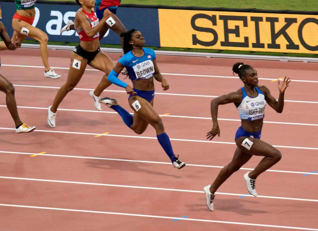 Dina Asher-Smith in the women's 200 metre final at the 2019 World Athletics Championships; licensed wide archival image.