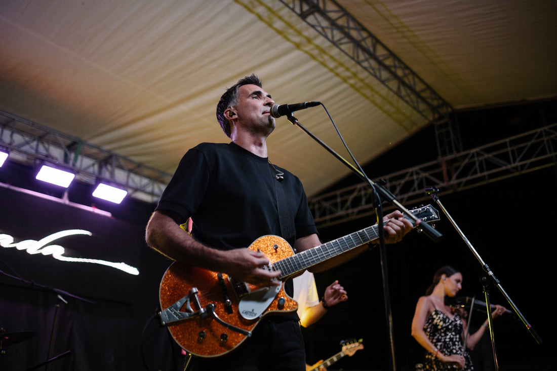 A musician performing live on an outdoor stage; licensed contextual image for Samantha Mumba's multi-career identity story.