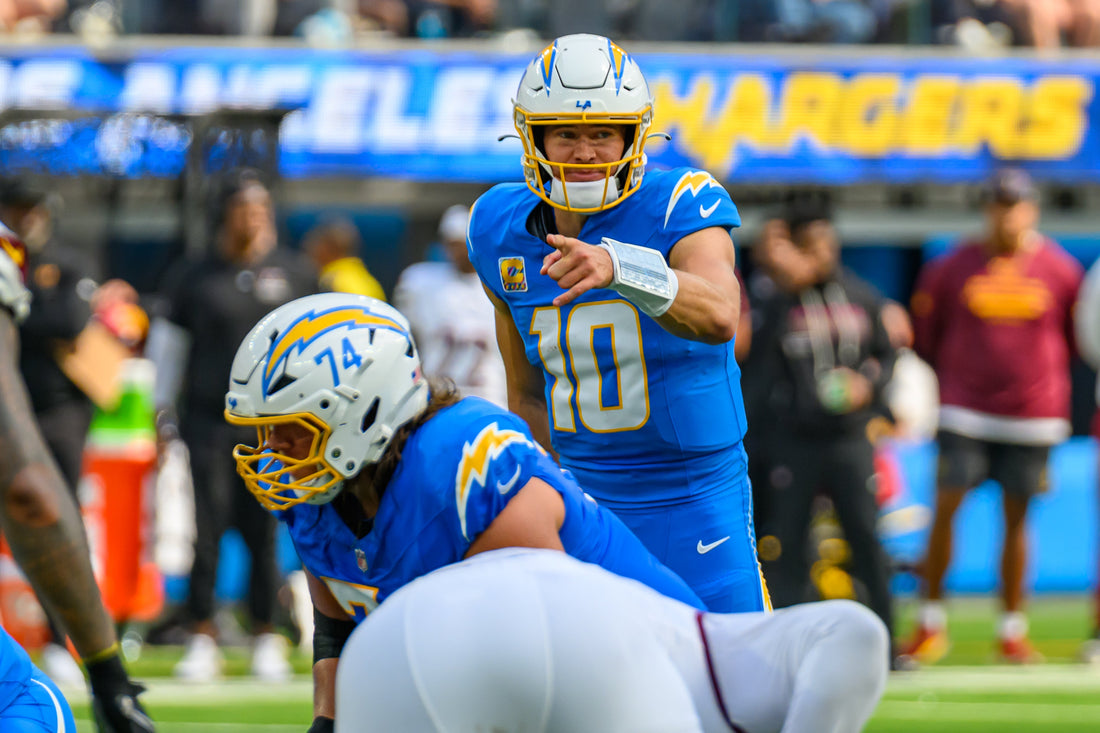 Justin Herbert pre-snap with the Los Angeles Chargers in 2025; wide contextual image for the Madison Beer and Justin Herbert engagement story.
