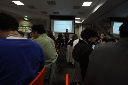 Mark Zuckerberg speaking at a technology event; licensed archival wide image.