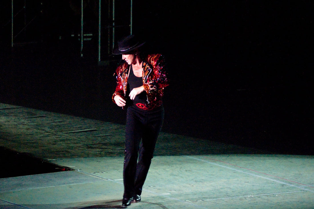 Archival photograph of Michael Flatley dancing in 2009, used for a 2026 story about the death of his wife Niamh O’Brien.