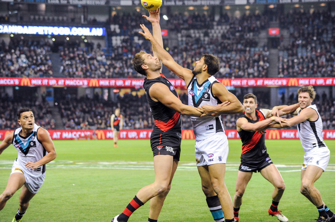 Archival photo of Paddy Ryder in an AFL ruck contest during Port Adelaide versus Essendon in 2017.