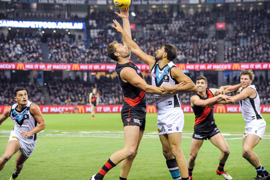 Archival photo of Paddy Ryder in an AFL ruck contest during Port Adelaide versus Essendon in 2017.