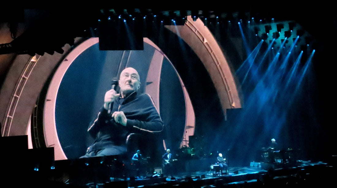 Phil Collins performing with Genesis in London during The Last Domino? Tour in March 2022