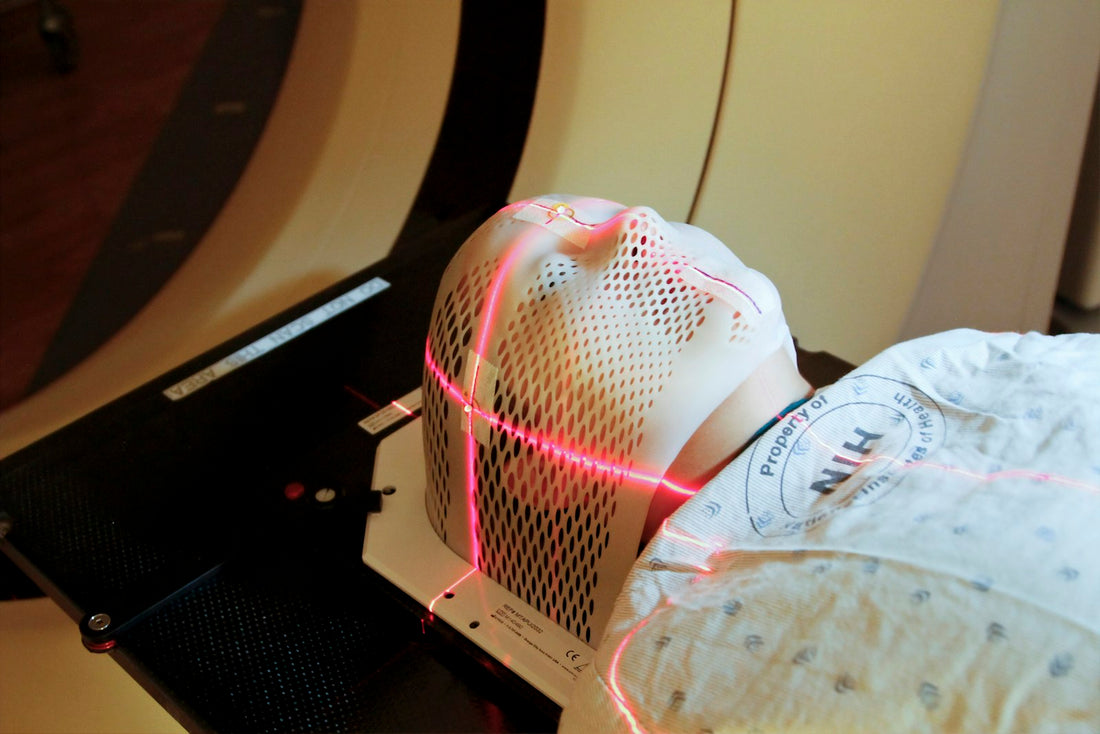 A patient positioned inside medical imaging equipment