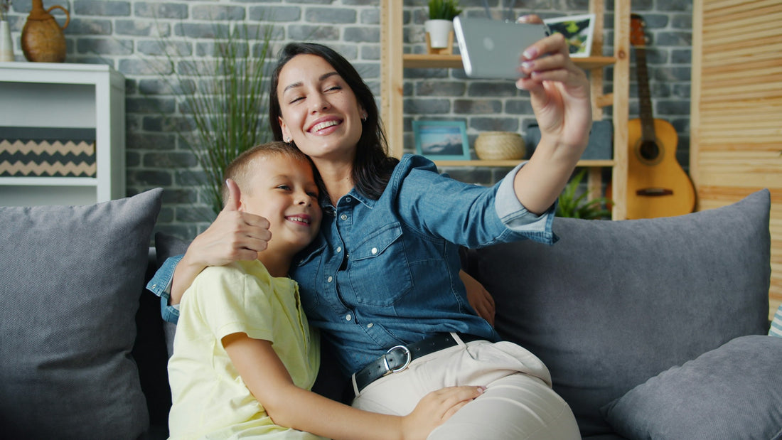 Mother and child taking a photo together on a smartphone, illustrating family photo privacy and AI upload decisions