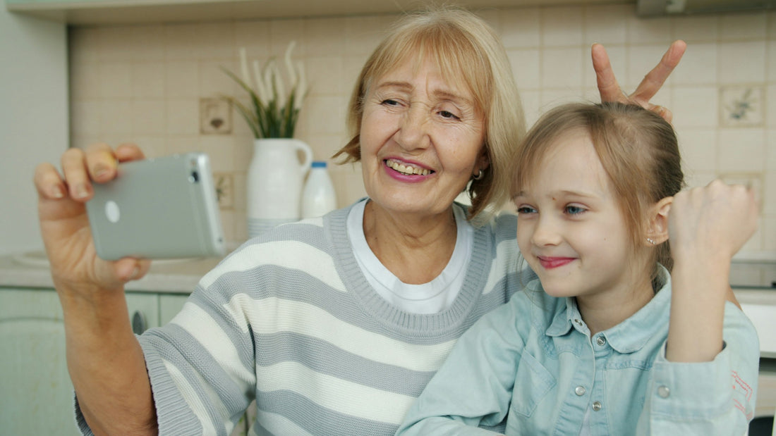 Grandmother and granddaughter taking a smartphone selfie, illustrating AI photo boundaries and family privacy