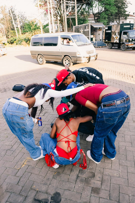 A group of young adults standing together in a circle