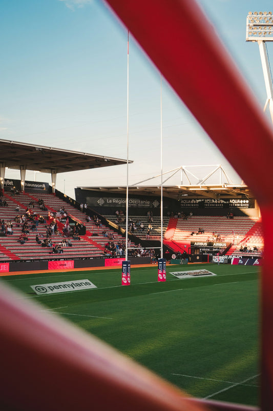 A rugby stadium and goalposts, reflecting Ryan Caldwell's life in professional rugby